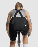 Assos UMA GT bib shorts on rider, back